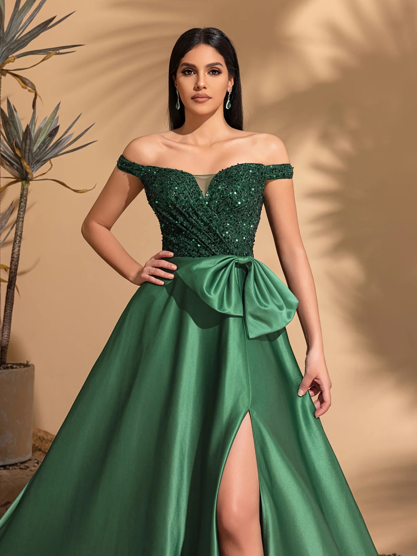 One-shoulder dress with bow decoration at waist and sequined satin hem