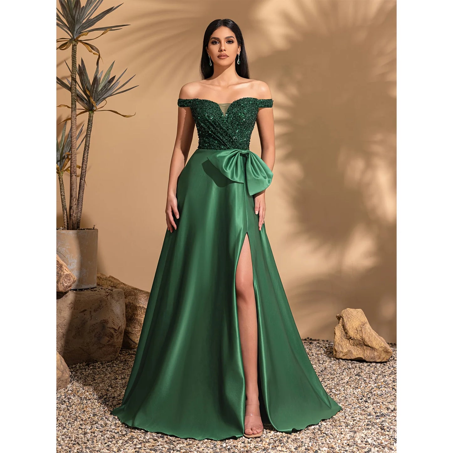 One-shoulder dress with bow decoration at waist and sequined satin hem